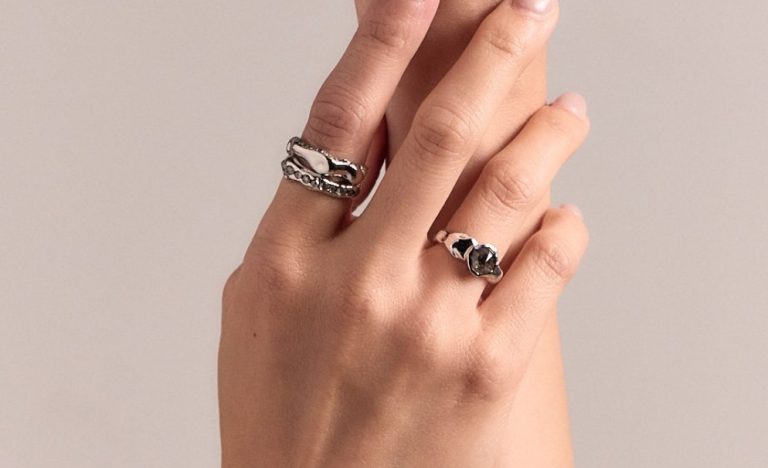 Salt-and-pepper diamond engagement ring on a natural stone surface, Singapore