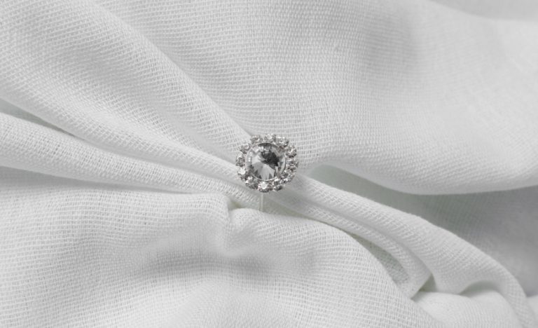 Woman wearing a self-purchased statement diamond ring on her right hand, Singapore